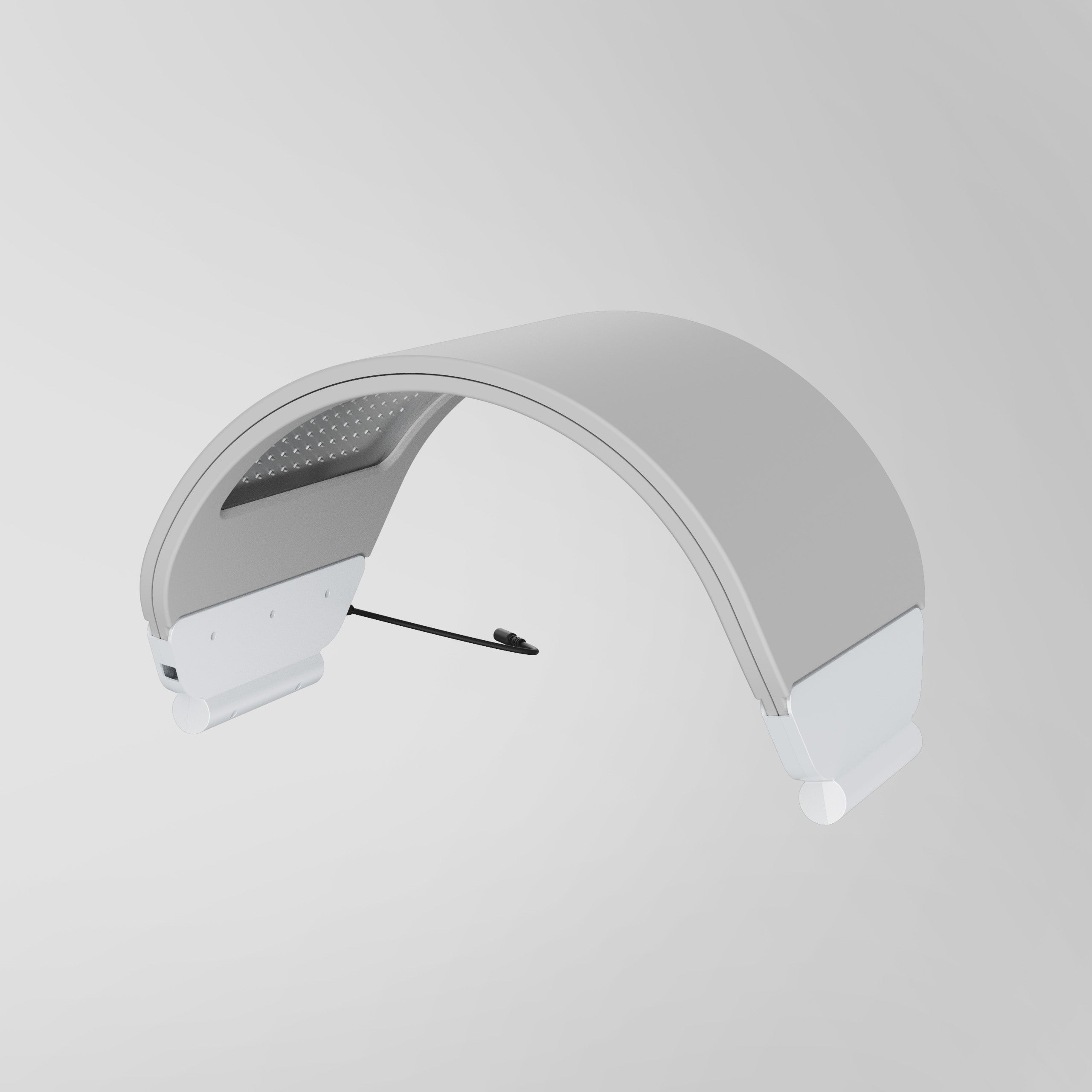 A white and light gray LED light therapy head for hair growth, shown floating against a neutral light gray background.